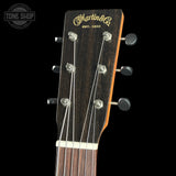 Guitar headstock with Martin & Co logo on a black background