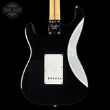 Floyd-Richardson Stratocaster electric guitar body in glossy black with a white pickguard and maple neck, shown against a black background.