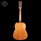 Back view of a wooden acoustic guitar on a black background with 'Tone Shop' branding.