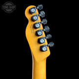 Guitar headstock with tuning pegs on a black background, featuring 'Tone Shop' branding.
