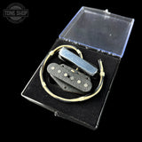 Electric guitar pickup set in a clear plastic case on a black background with 'Tone Shop' branding.
