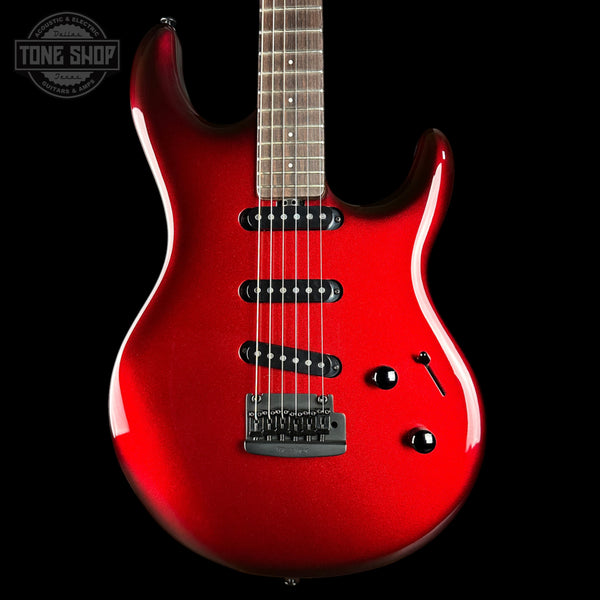 Red electric guitar on a black background with 'Tone Shop' logo.
