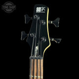 Bass guitar headstock with 'S.D.G.R' branding on a black background