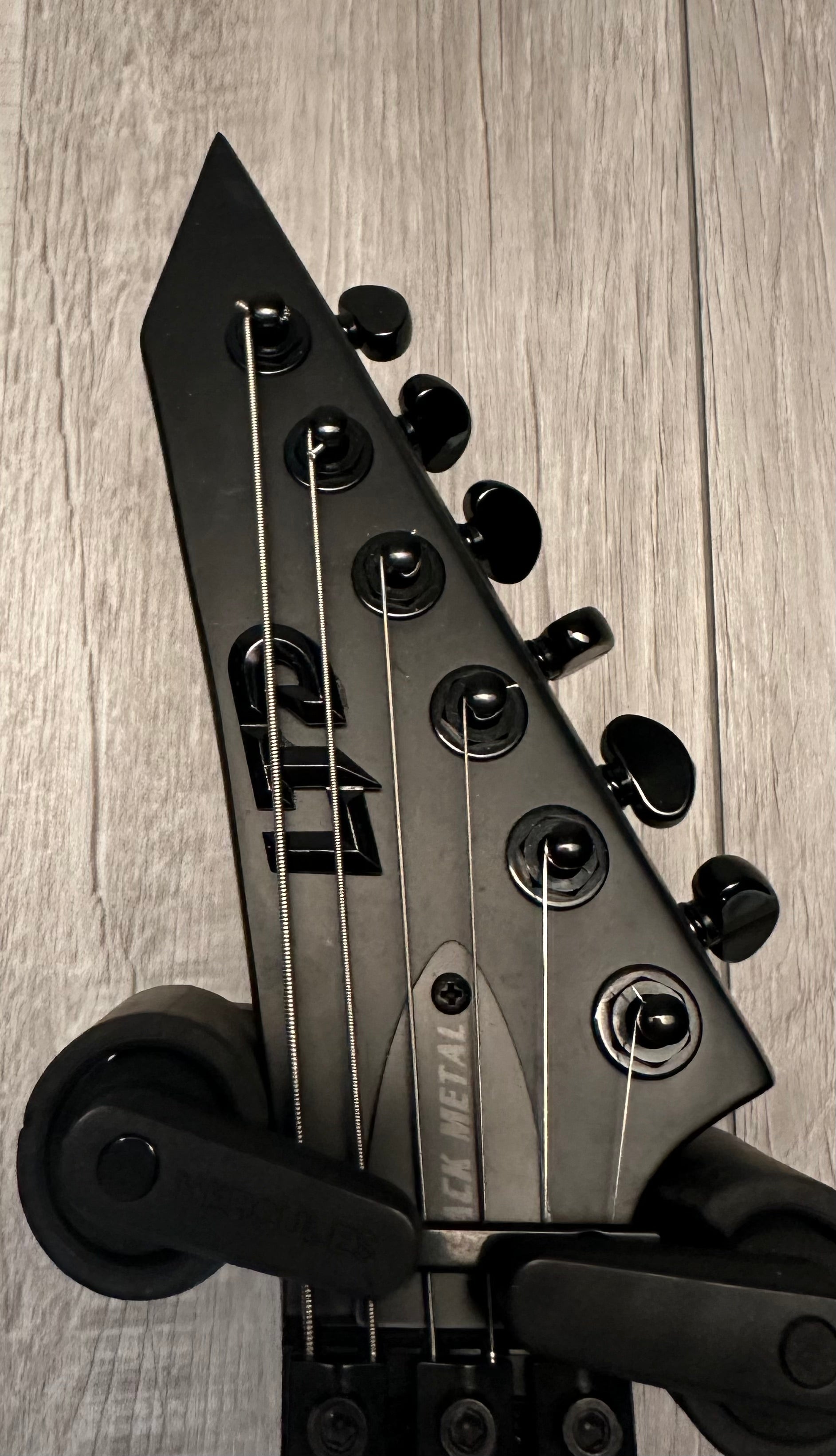 Headstock of Used ESP LTD Arrow Black Metal TSS3604