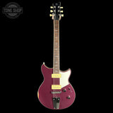 A purple electric guitar with a white pickguard and gold hardware, shown against a solid black background. A Tone Shop watermark is visible in the top-left corner.