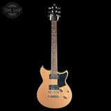 A classic electric guitar with a natural wood finish, black pickguard, and chrome hardware, shown against a solid black background with a Tone Shop logo in the top-left corner.