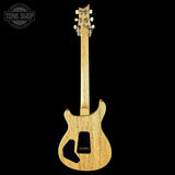 Electric guitar with a visible brand logo on a black background