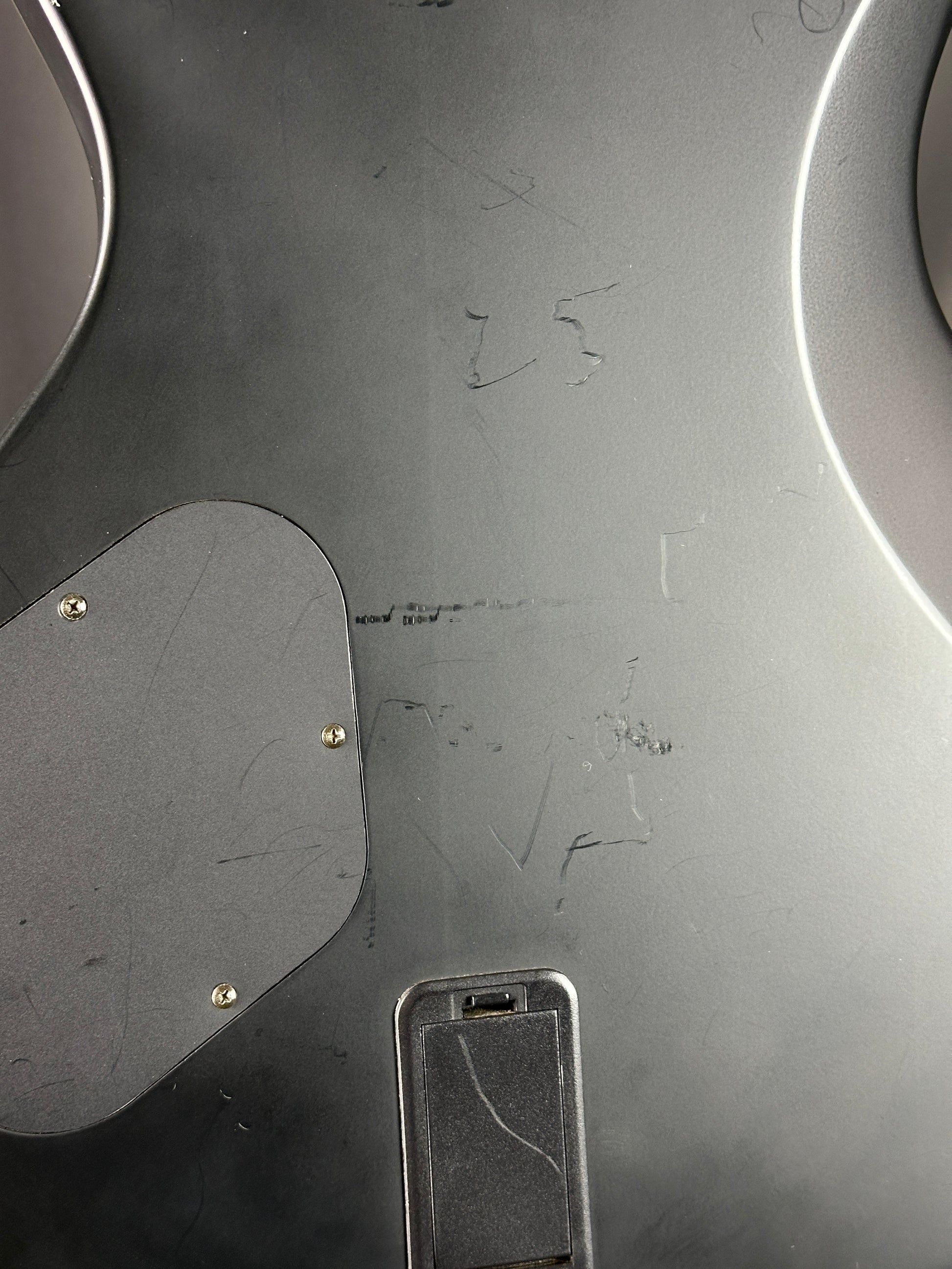 Close-up of a metallic surface with visible wear and tear