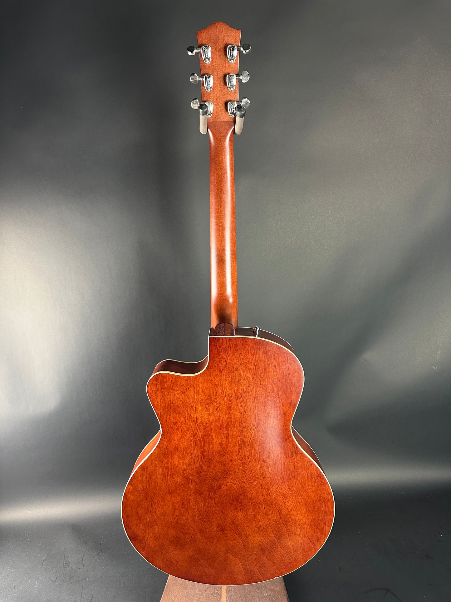 Acoustic guitar on a gray background