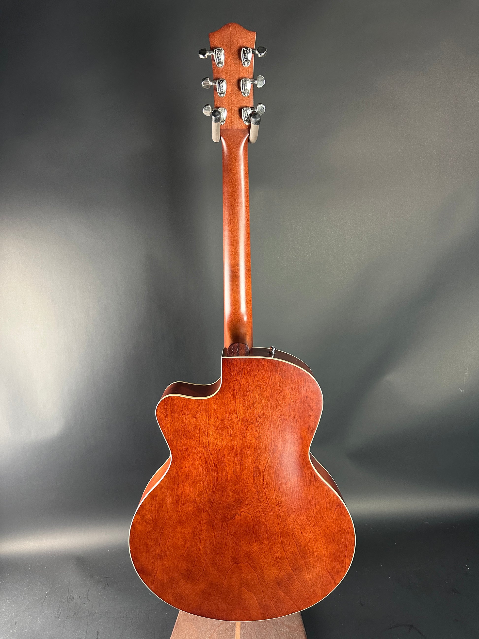 Acoustic guitar on a gray background