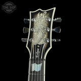 ESP Eclipse guitar headstock on a black background