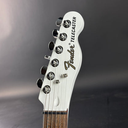 Fender Telecaster guitar headstock on a gray background