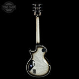 Back view of a silver electric guitar on a black background with 'Tone Shop' logo.