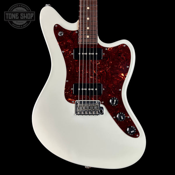 White electric guitar with a red flame pattern on a black background, featuring 'Tone Shop' branding.
