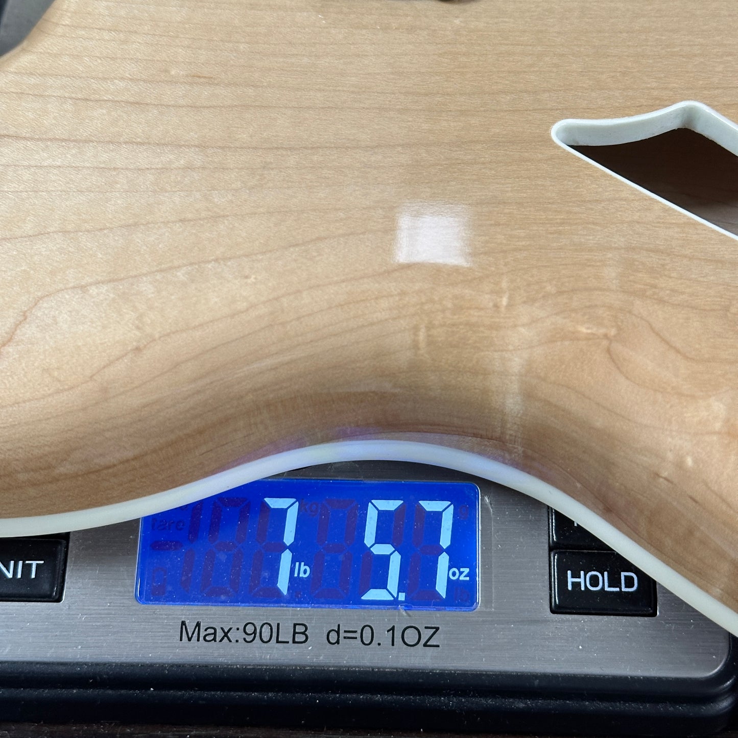 Used 2009 Rickenbacker 360 Mapleglo on a scale displaying weight.