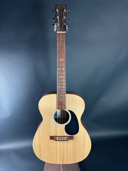 Acoustic guitar on a dark blue gradient background