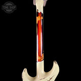 Close-up of a guitar with a flame maple neck on a black background, featuring the Tone Shop logo.