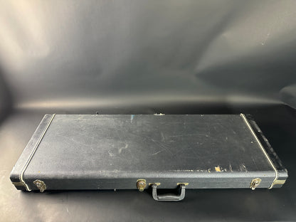 Black rectangular case with visible wear on a dark background