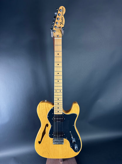 Electric guitar with a Fender logo on a dark blue background