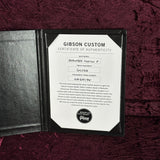 Gibson Custom Certificate of Authenticity on a dark background