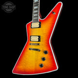 Electric guitar with a sunburst finish on a black background, featuring the Tone Shop logo.
