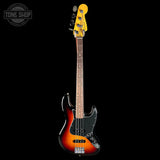 A classic four-string bass guitar with a sunburst finish, featuring a black pickguard and a bright yellow headstock, shown against a solid black background.