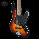 A classic four-string bass guitar with a sunburst finish, featuring a black pickguard, chrome hardware, and a dark wood fretboard, shown against a solid black background with a Tone Shop watermark in the top left.