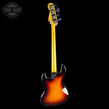 A classic electric guitar shown from the back, featuring a vibrant sunburst finish that transitions from bright yellow-orange to deep black, with a bright yellow maple neck and headstock, photographed against a solid black background.