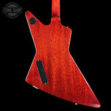 Red electric guitar body on a black background with 'Tone Shop' logo.