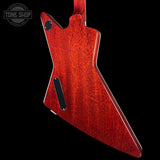 Red guitar body with a black pickguard on a black background, featuring 'Tone Shop' logo.