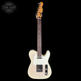 A classic Fender Telecaster electric guitar in a cream natural finish, shown vertically against a solid black background. The guitar features a maple body, dark brown maple fretboard, and a yellow-orange headstock with the Fender logo.