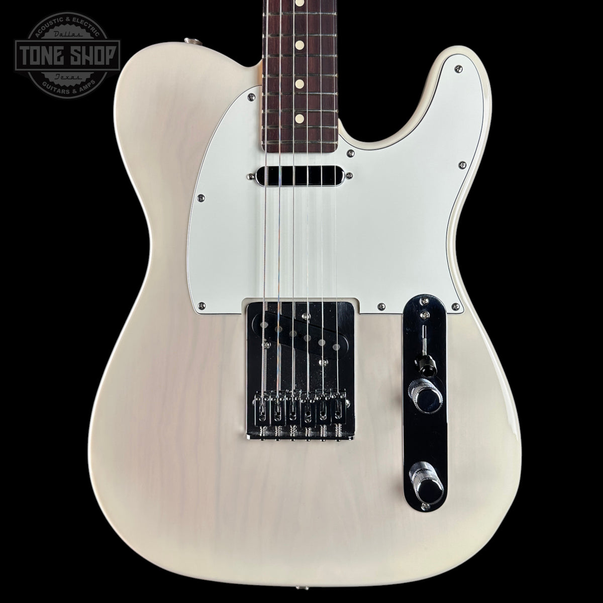 A classic Fender Telecaster-style electric guitar with a cream-colored body, white pickguard, and black hardware, shown against a solid black background. A Tone Shop watermark is visible in the top-left corner.