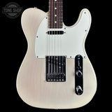 A classic Fender Telecaster-style electric guitar with a cream-colored body, white pickguard, and black hardware, shown against a solid black background. A Tone Shop watermark is visible in the top-left corner.