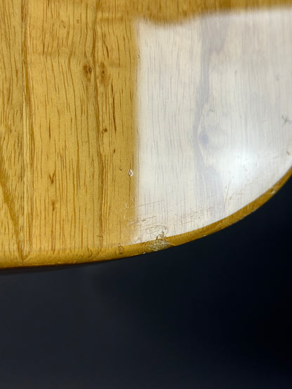 Close-up of a wooden surface with a dark background