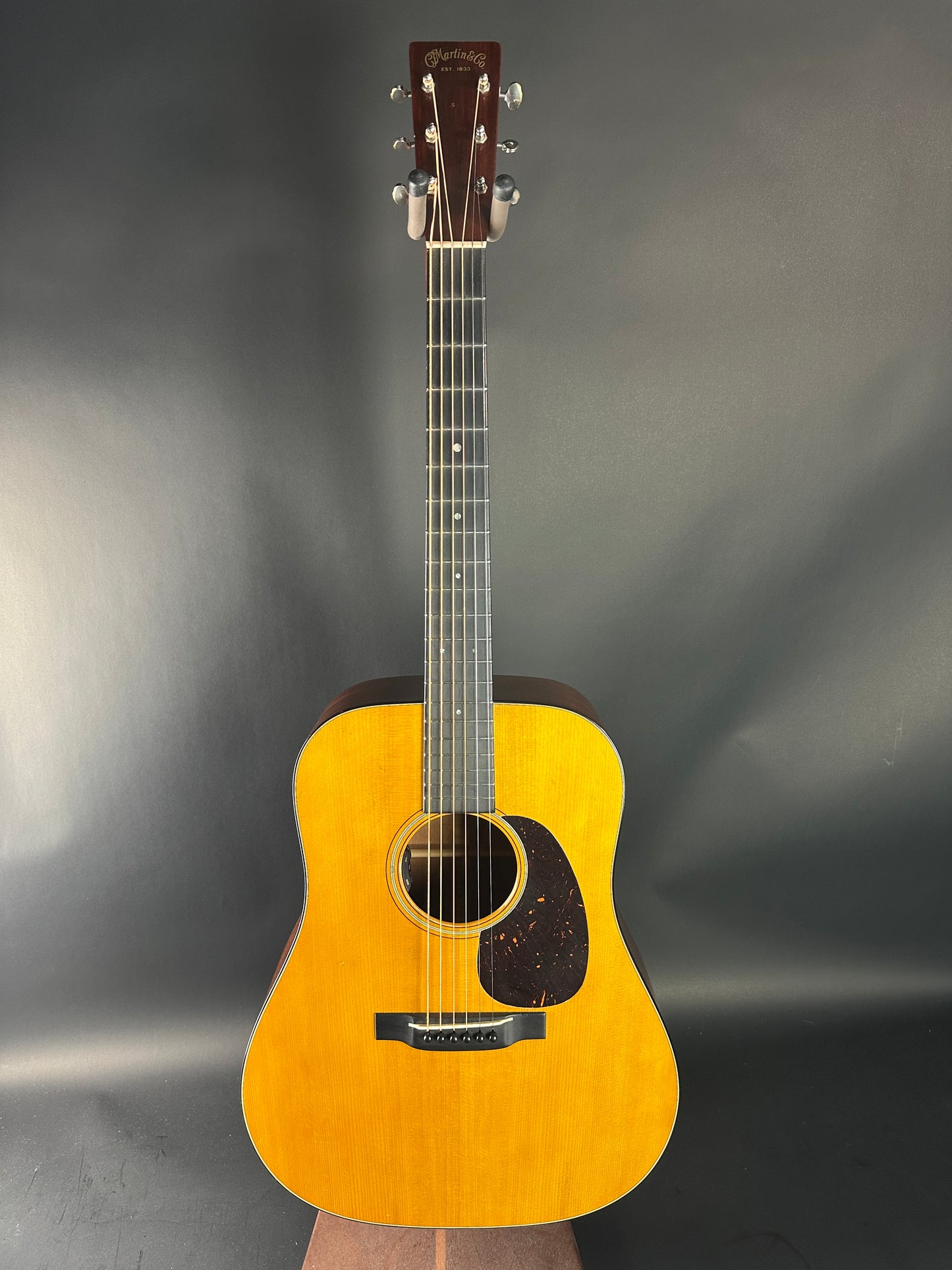 Acoustic guitar on a gray background