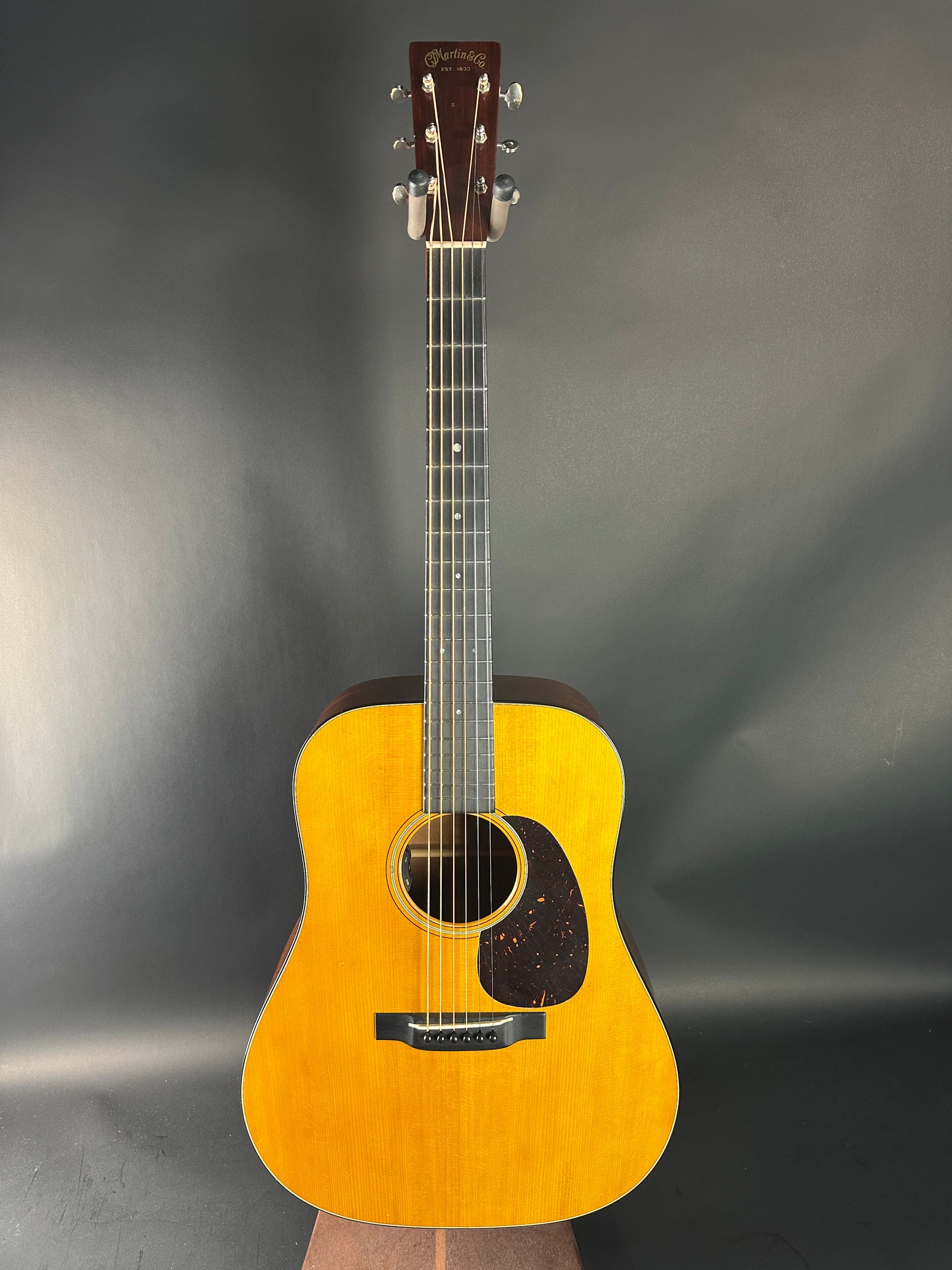 Acoustic guitar on a gray background