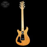 Electric guitar with a PRS logo on a black background