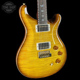 Electric guitar with a sunburst finish on a black background, featuring the Tone Shop logo.
