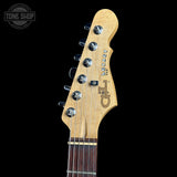 Gibson Les Paul guitar headstock with brand logo on a black background