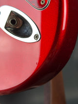 Close-up of a red motorcycle headlight with a blurred background
