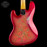 Close-up of the back of a red electric guitar body with a distressed gold and green paisley pattern, set against a black background. A 'TONE SHOP' watermark is visible in the top left corner.