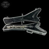 Guitar in a hard-shell case with 'Tone Shop' logo in the corner.