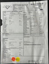 A printed Fender Shop Floor Traveler form sheet for a 4100S P Jazz Bass Rel. CHT18S, photographed from above on a dark surface.