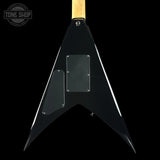 Black guitar body with a wooden neck on a black background, featuring 'Tone Shop' branding.