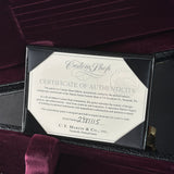 Certificate of authenticity for a Martin guitar on a dark background