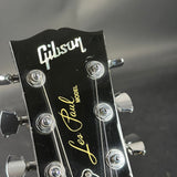 Gibson guitar headstock with brand name and model details.