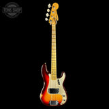 A classic Fender bass guitar with a sunburst finish, featuring a yellow maple neck and headstock, shown against a solid black background with a Tone Shop watermark in the top left corner.