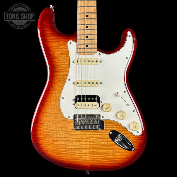 Electric guitar with a sunburst finish on a black background, featuring the Tone Shop logo.