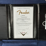 A Fender authenticity certificate insert displayed inside a black leather portfolio case lined with blue velvet. The certificate is for a Yacht Cust 68 Blue Flower Tele Nos instrument by Fender Music.
