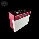 A small guitar amplifier with a textured red top and sides, and a brushed silver front grille. The brand name 'MIGHTONE' is displayed on a black badge on the front.